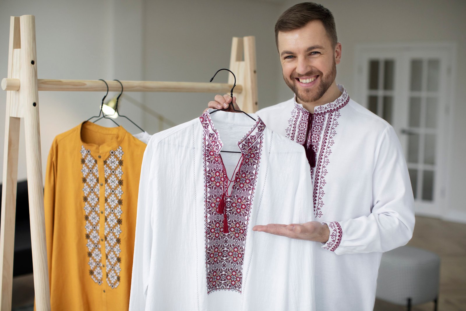 medium-shot-smiley-man-holding-hanger
