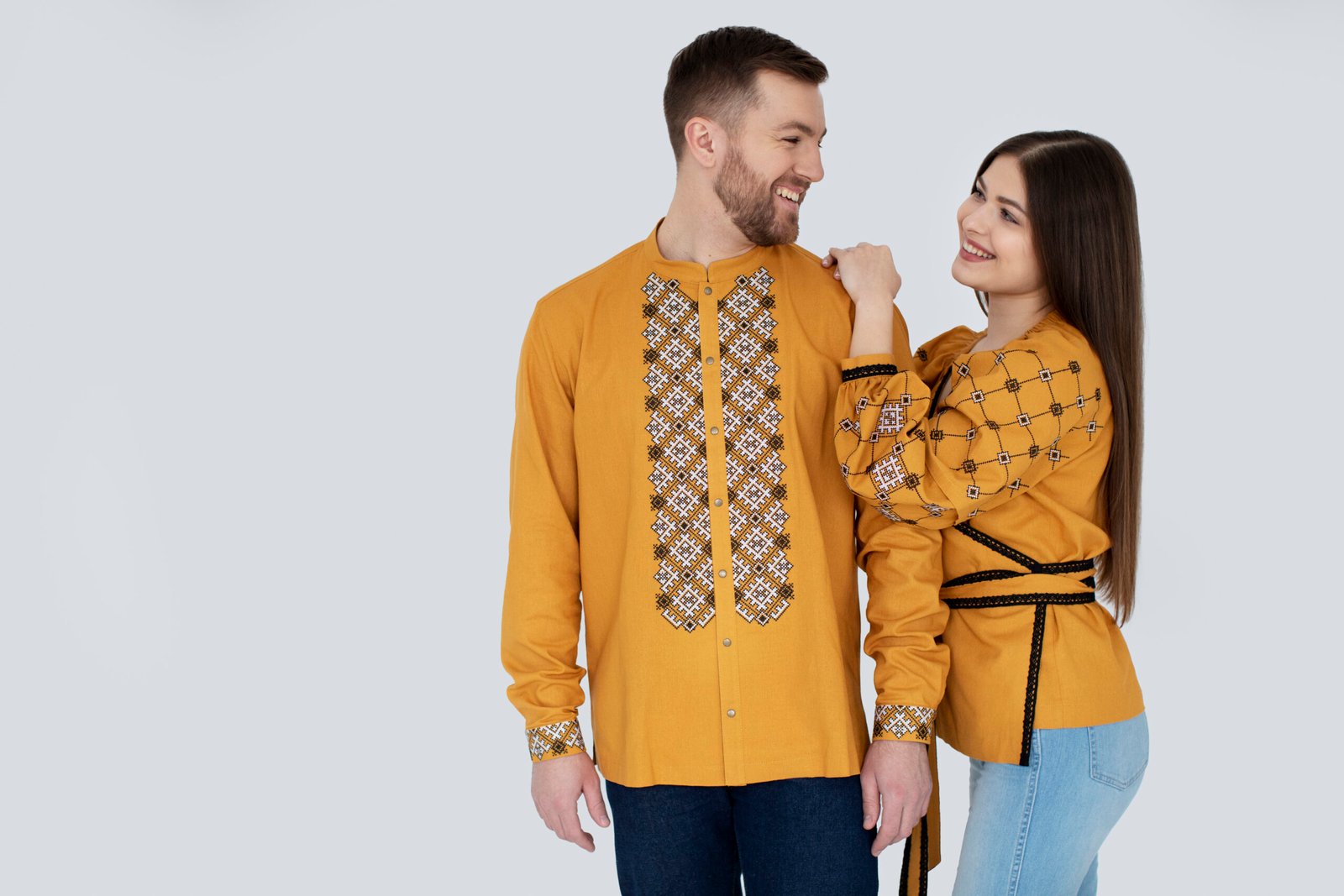 medium-shot-smiley-people-wearing-ukranian-shirts